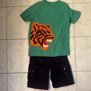 Hanna Andersson Green Tee with Tiger Graphic and Black Cargo Shorts.